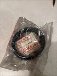 Nos Kawasaki Meter Cover #25012-003. Fixed Price $40.00.