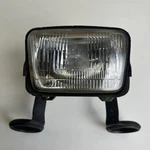 Suzuki 400SM 2010 Front Headlight With Mount Brackets. Fixed Price $272.19.